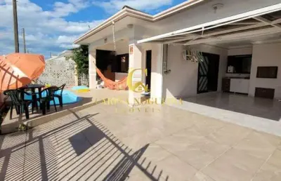 Casa em atlântida sul com piscina e 2 quadras da beira mar.