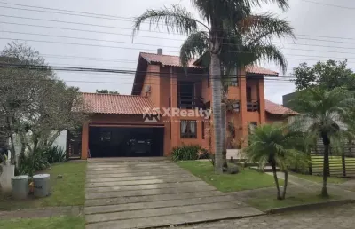 Casa em condomínio fechado com 4 quartos à venda na rodovia doutor antônio luiz moura gonzaga, 647, rio tavares, florianópolis por r$ 4.500.000