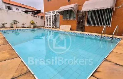 Casa jardim guanabara com piscina e área de lazer, com cinco quartos,sendo três suites.