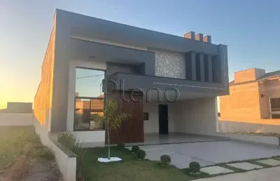Linda casa em indaiatuba, construção recente, três suítes, escritório, jacuzzi e aquecimento solar localizada no condomínio park gran reserve