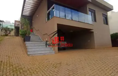 Aluga-se casa moderna com 4 suítes em 1.000m² de área bairro  garças!