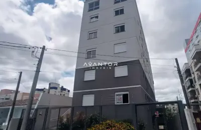 Apartamento central de 1 dormitório, suíte, sala de estar, cozinha e churrasquei
