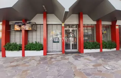 Loja sala comercial central composta por 4 salas, 4 banheiros, terraço e sacada.
