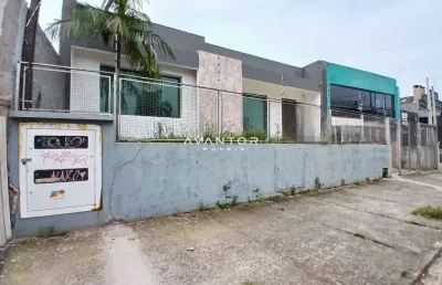 Casa comercial ampla no bairro lourdes com 4 salas, 3 banheiros, pátio e estacio