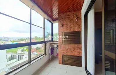 Apartamento 2 dormitórios com suíte e sacada com churrasqueira em bairro nobre.