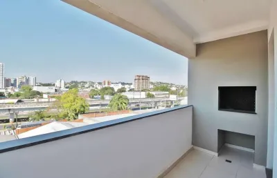 Apartamento 2 dormitórios com suíte, sacada com churrasqueira e box no bairro ideal