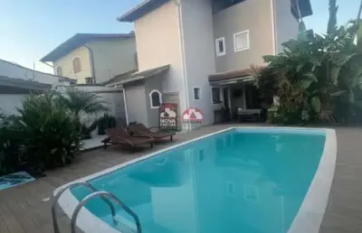 Casa com 4 quartos para alugar na Rua Itapoan, Sobrado De Alto Padrão, 157, Martim de Sá, Caraguatatuba