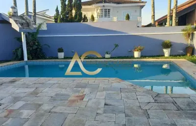 Casa em condomínio fechado com 4 quartos para alugar no Jardim Acapulco, Guarujá 