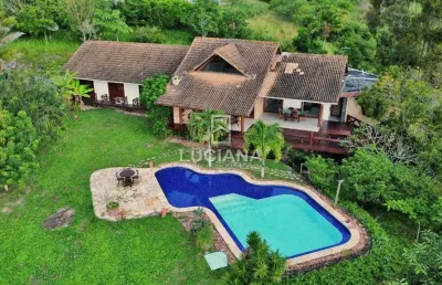 De r$1.600.000 por r$1.400.000! casa com 4 suítes e vista incrível em condomínio