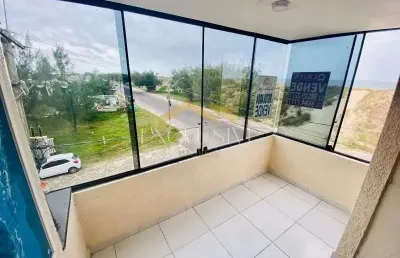 Apartamento 03 dormitórios a beira mar com sacada em tramandaí