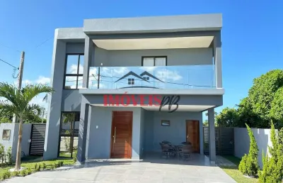 Casa em condomínio fechado , 04 quartos sendo 02 suítes e com vista mar