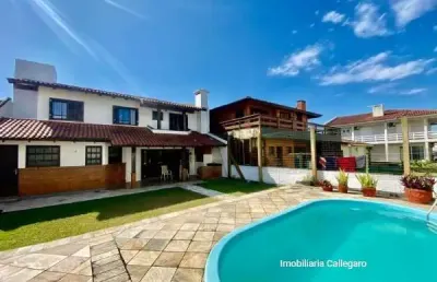 Casa com 4 quartos à venda na 03 de outubro, 03111, zona nova, tramandaí por r$ 810.000