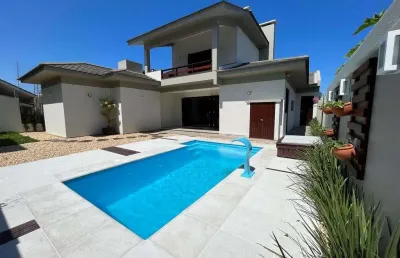 Casa com 4 quartos à venda na rua miraguaia, 505, atlântida, xangri-lá, 270 m2 por r$ 1.980.000