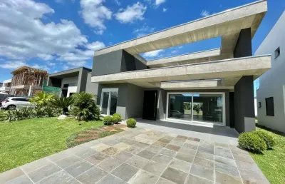 Casa em condomínio fechado com 4 quartos à venda na rua onório germano, 2009, condomínio dubai resort, capão da canoa, 240 m2 por r$ 1.650.000