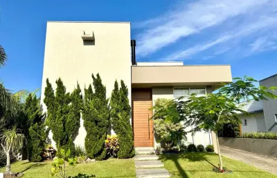Casa em condomínio fechado com 5 quartos à venda na rua onório germano, 2009, condomínio dubai resort, capão da canoa por r$ 1.800.000