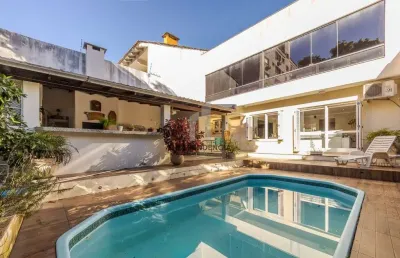 Casa com 3 quartos à venda na rua paulo setúbal, 107, passo da areia, porto alegre por r$ 1.324.000