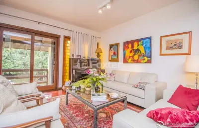 Casa 4 dormitórios à venda rua desembargador hugo candal, três figueiras - porto alegre
