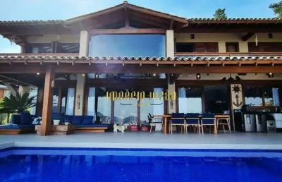 Casa de alto padrão à venda com 9 suítes, sendo 1 master, espaço gourmet e piscina com borda infinita no condomínio fazenda arrozal - ilhabela-sp
