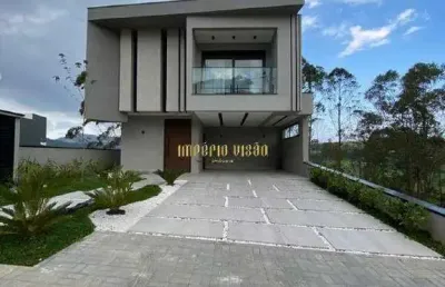 Casa de alto padrão à venda com 3 suítes, espaço gourmet e piscina com borda infinita no condomínio aruã brisas 2 - mogi das cruzes-sp