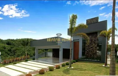 Casa de alto padrão à venda com 3 suítes, sendo 1 master e piscina no condomínio reserva ibirapitanga - santa isabel-sp