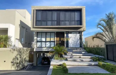 Casa de luxo com área gourmet e piscina à venda no condomínio arujá 5, infraestrutura magnífica e totalmente moderna.