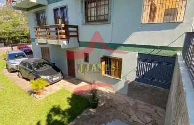 Casa com 4 quartos à venda na rua açores, 776, tarumã, viamão por r$ 1.000.000
