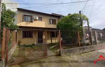 Casa com 4 quartos à venda na Rua Doutor Cláudio Walter Ferreira da Silva, 191, Guarujá, Porto Alegre