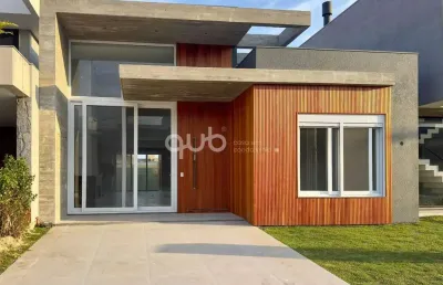Casa à venda com 4 suítes, 5 banheiros, 2 vagas de garagem, no condomínio sunset, em xangri-lá/rs.