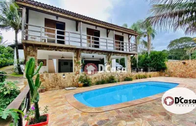 Casa a venda no condomínio chácaras cataguá, com área total de 2201m2, 4 quartos e ampla área gourmet com piscina, taubaté-sp.