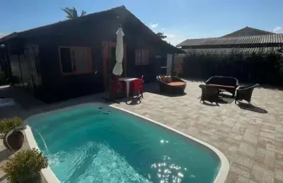 Casa com piscina a venda 'porteira fechada' em praia do meio, palhoça/sc