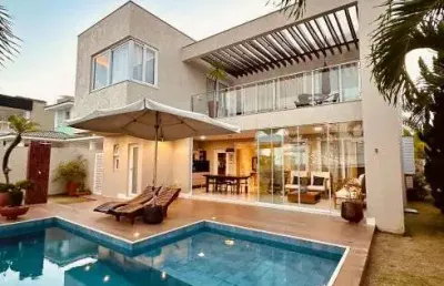 Excelente casa com arquitetura moderna com 306 m2 com 4/4 em alphaville l. norte - camaçari
