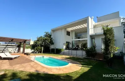 Casa 6 dormitórios sendo 5 suítes em condomínio fechado, cacupé - florianópolis/sc.