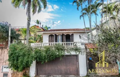 Casa com 3 quartos à venda na rua oscar tollens, 170, santa tereza, porto alegre por r$ 450.000