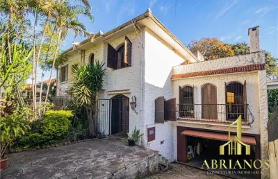 Casa com 5 quartos à venda na rua professor ivo corseuil, 129, petrópolis, porto alegre por r$ 1.350.000