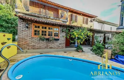 Casa em condomínio fechado com 4 quartos à venda na das figueiras, 108, santa tereza, porto alegre por r$ 650.000