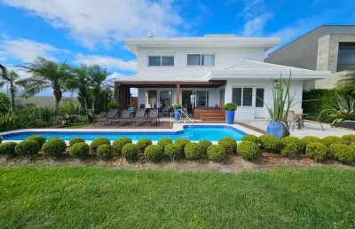 Casa em condomínio fechado com 4 quartos à venda na rua rio jacuí, 1331, centro, xangri-lá por r$ 3.850.000