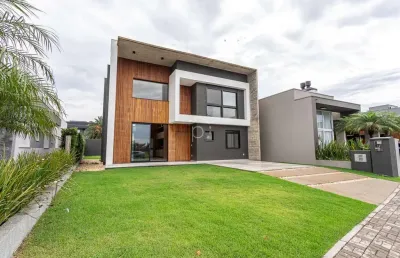 Casa em condomínio fechado com 4 quartos à venda na divida, 750, centro, xangri-lá por r$ 2.180.000
