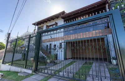 Casa com 3 quartos à venda na rua doutor egydio michaelsen, 250, cavalhada, porto alegre por r$ 950.000