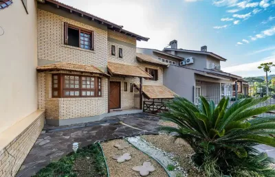 Casa com 4 quartos à venda na rua lloyd de andrade polidoro, 60, ipanema, porto alegre por r$ 1.250.000