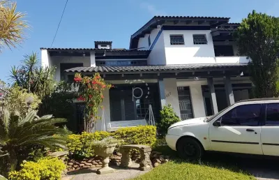 Casa com 4 quartos à venda na rua doutor mário totta, 2087, tristeza, porto alegre por r$ 1.680.000