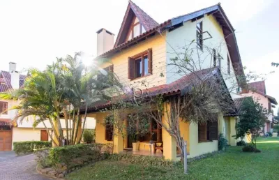 Casa em condomínio fechado com 3 quartos à venda na rua luís felipe monmany, 101, guarujá, porto alegre por r$ 650.000