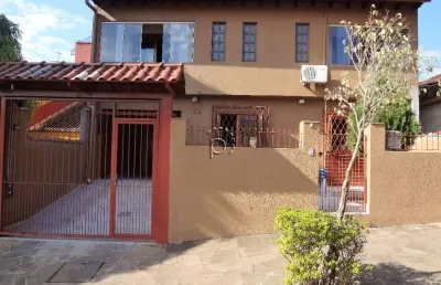 Casa com 4 quartos à venda na rua adroaldo novo correa, 126, cavalhada, porto alegre por r$ 750.000