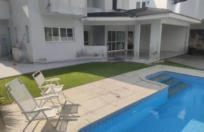 Casa com piscina e 4 suites a venda na praia do pernambuco guaruja sp
