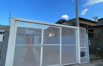 Casa térrea 02 dormitórios, pátio nos fundos, churrasqueira e 02 vagas para veículos no bairro rio branco