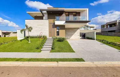 Alphaville jundiaí 1 - casa moderna à venda no alphaville jundiaí 1 com 4 suítes, piscina, área gourmet e energia solar