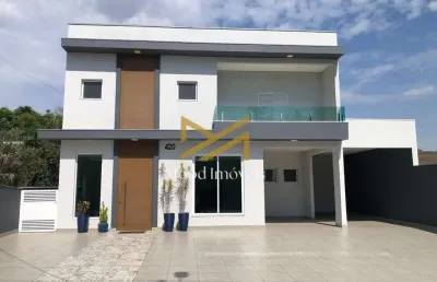 Casa a venda no arujá country club ideal para quem procura suítes no nível térreo.....  este lindo sobrado, possui no nível térreo: 6 vagas sendo 2 cobertas; sala para 3 ambientes