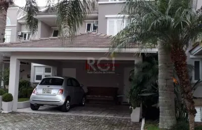 Casa em condomínio fechado, às margens do rio guaíba,