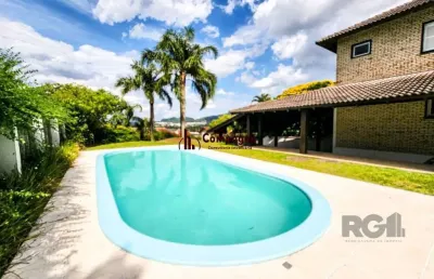 Casa em condomínio 5 dormitórios à venda cavalhada porto alegre/rs
