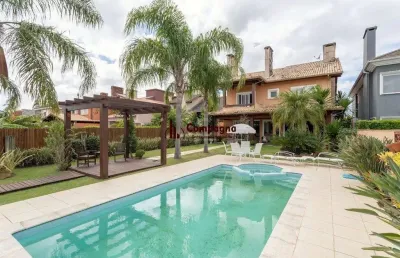 Casa em condomínio 4 dormitórios à venda belém novo porto alegre/rs