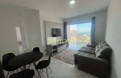 Apartamento novo à venda, com dois dormitórios sendo uma suíte, a 400m da orla do indaiá, em caragu